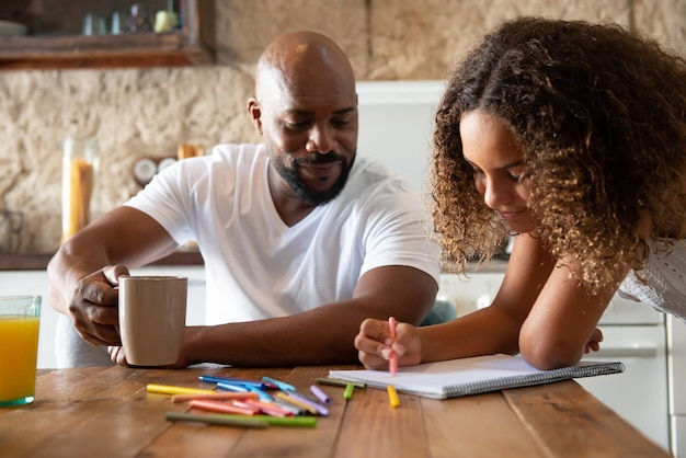 singleparent family in the kitchen of their home sharing moments together