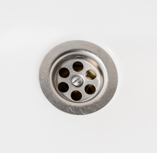 Sink drain with metal filter, white faience, close up