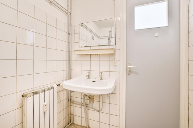 Sink and mirror near bathroom door