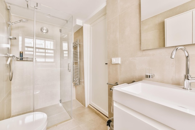 Sinks and bathtub near shower cabin