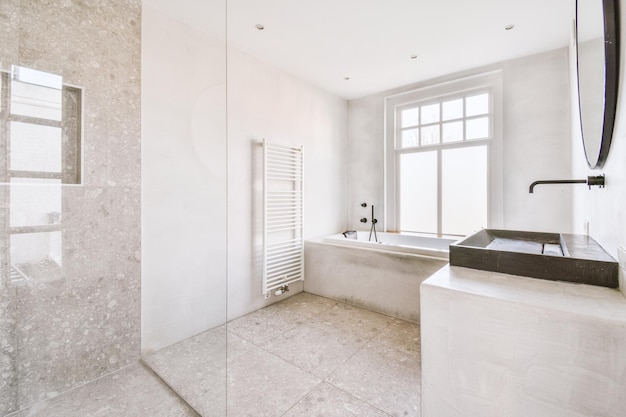 Sinks and bathtub near shower cabin