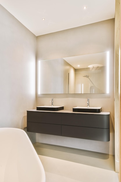 Sinks and bathtub near shower cabin