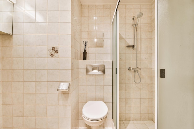 Sinks and toilet near shower cabin