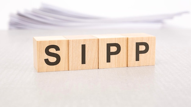 Sipp word written on wood cubes with white background