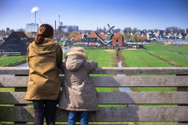 The sisters look at wind mills in Zaanse Schans