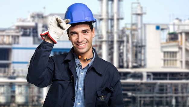 Site manager portrait holding his helmet