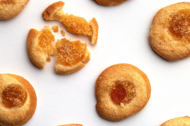 Six handmade cookies with apricot jam arranged in even rows