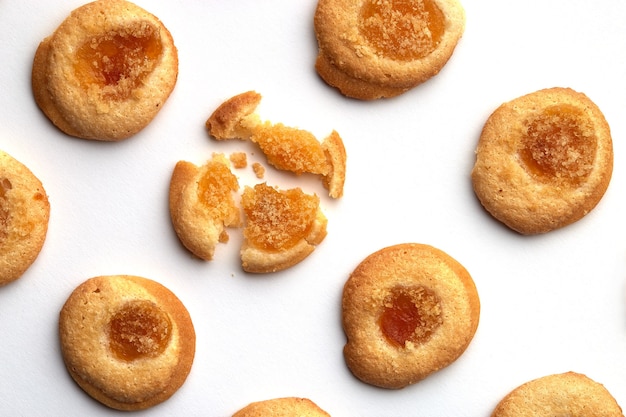 Six handmade cookies with apricot jam arranged in even rows