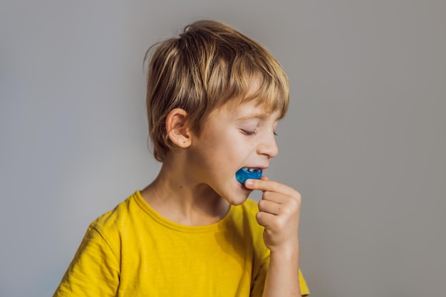 Sixyear old boy shows myofunctional trainer Helps equalize the growing teeth and correct bite develop mouth breathing habit Corrects the position of the tongue