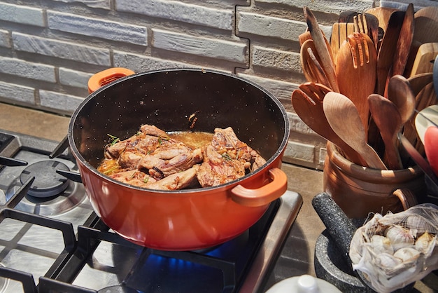 Sizzling HomeCooked Beef Juicy cuts seared to perfection on a gas stove in a cozy kitchen