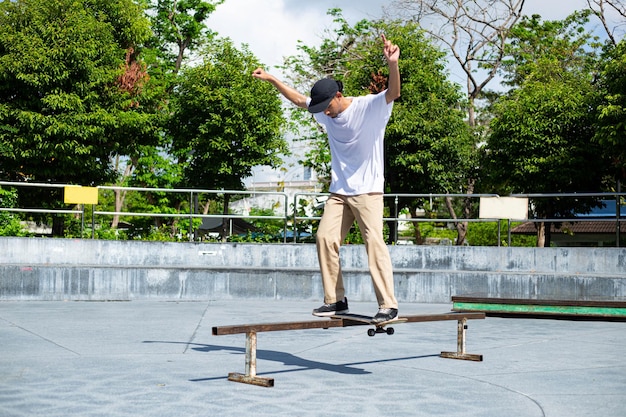 Skateboard man flip board in the sport areaSport man funny with his hobby in the outside