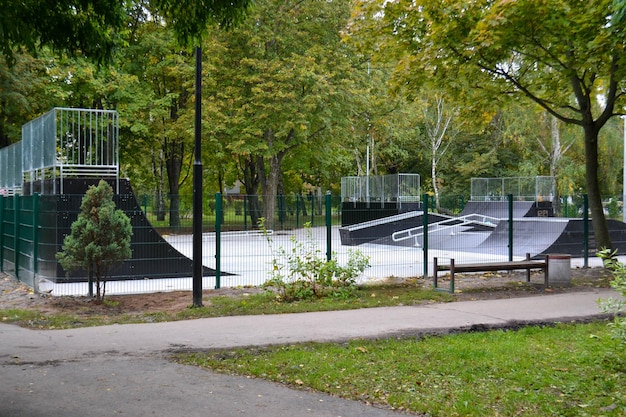 Skatepark ramps in the park on autumn