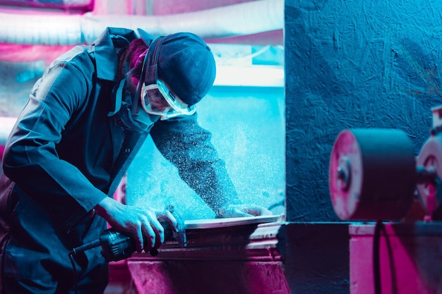 Skater in process of making his own skateboard