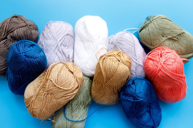 Skeins of wool yarn and knitting needlesxA