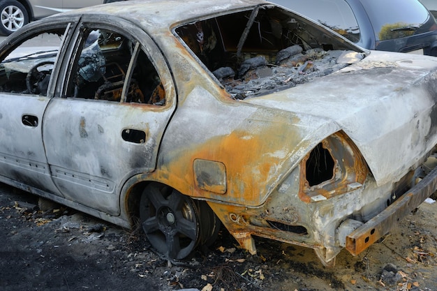 Skeleton of burnt out car.Trunk of a burnt out car.