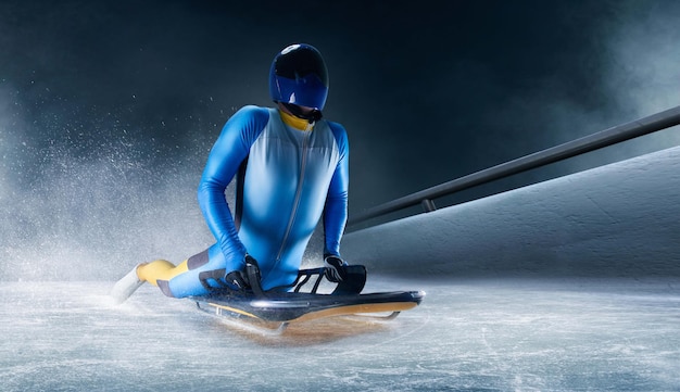 Skeleton sport Bobsled Luge The athlete descends on a sleigh on an ice track