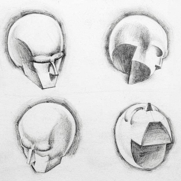 Sketch of different geometric figures in shape of human head drawing by hand with black pencil on white paper Collage concept