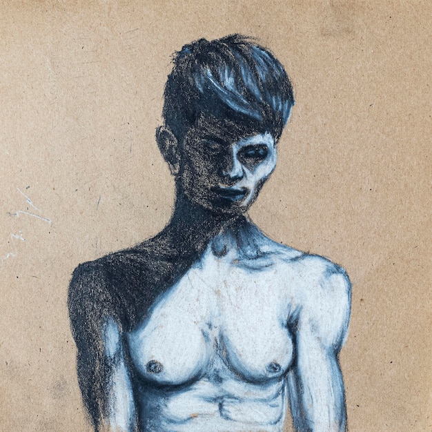 Sketch of young guy drawing by hands with black and white chalk and charcoal on beige textured paper