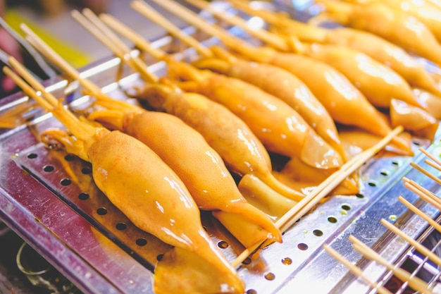 Skewered squid beautifully arranged in a tray