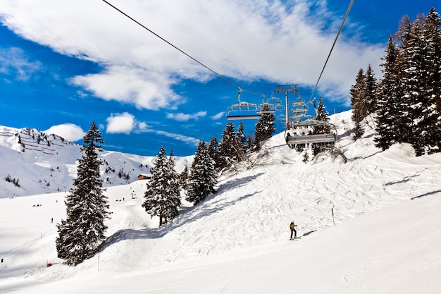 Ski chair lift moving, rope way in Alps mountains in Mayerhofen, Austria