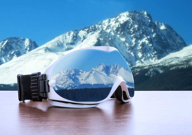 Ski glasses against mountains