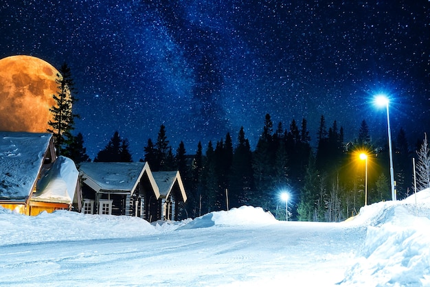 Ski resort at night sweden ski resort are at night wooden cottages in mountains with stars on sky