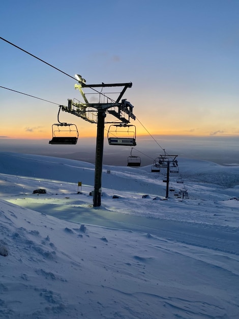 Ski resort at sunset Nothern winter landscape ski corduroy