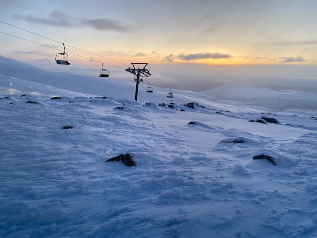 Ski resort at sunset Nothern winter landscape ski corduroy