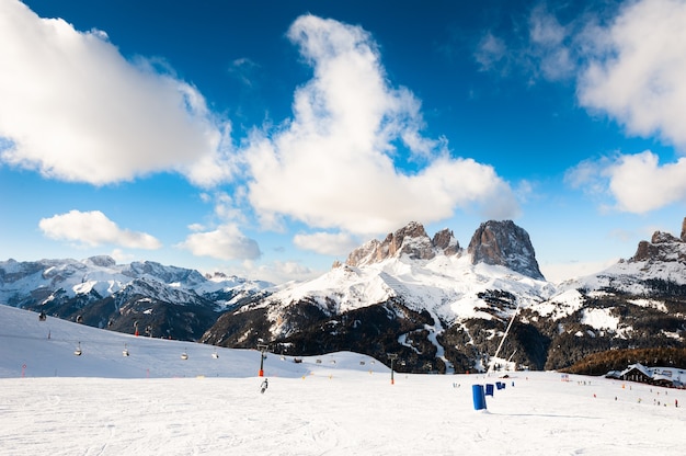 Ski slope in ski resort in Dolomite Alps. Val Di Fassa, Italy