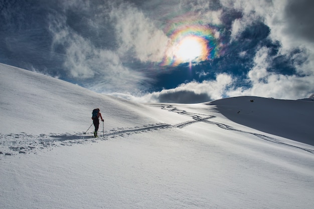 Ski track randonee uphill on the italian alps