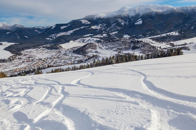 Ski trail and traces  on the top of  mountain with valley view Western Tatras Ski resort of Zuberec Slovakia Tourist winter destination skiing Winter sport entertainment