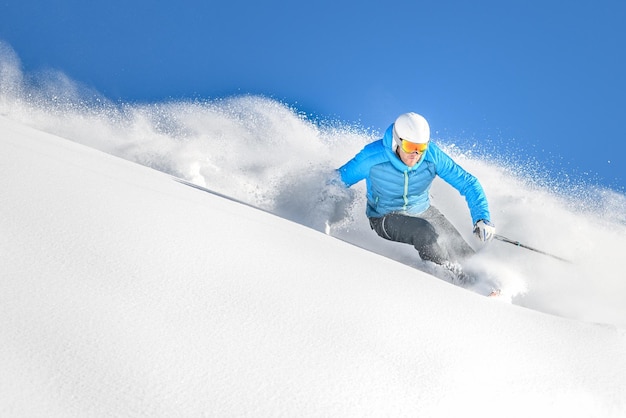 A skier in powder offpiste