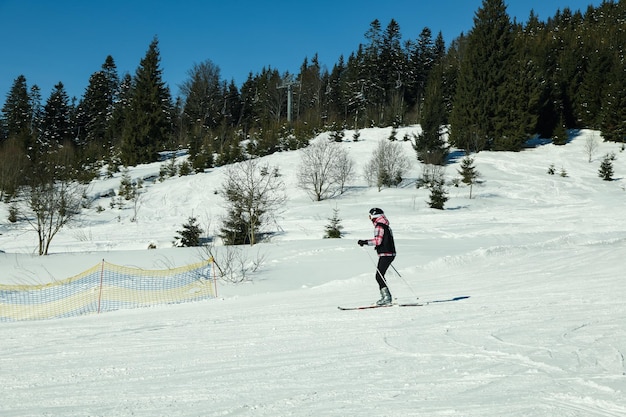 Skier ride on mountain resort in sunny day