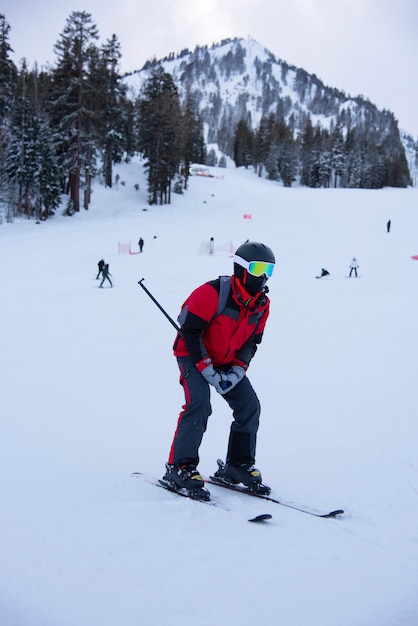 Skier skiing downhill in high mountains