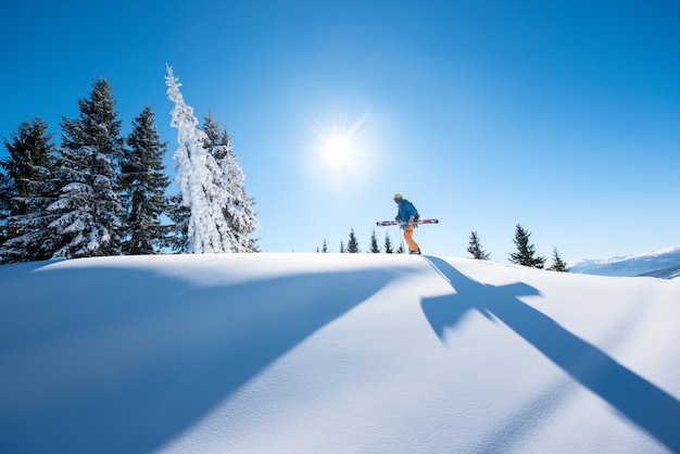 Skier on slope in mountains on winter day