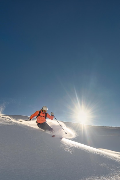 Skier on a sunny day of fresh snow