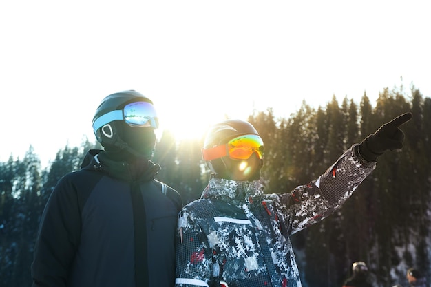 Skiers in goggles and ski helmets outdoor