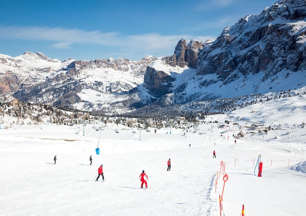 Skiers at ski resort in Dolomites