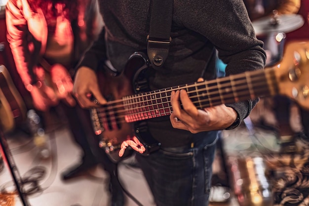 Skilled bassist playing closeup