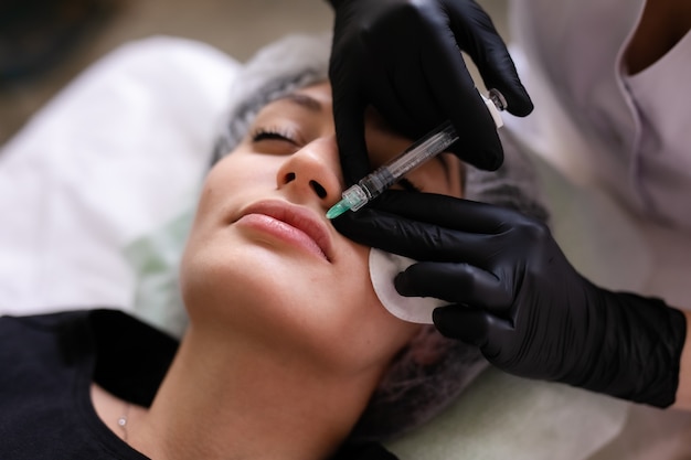 Skin care concept. A woman in a beauty salon during a facial skin care treatment.