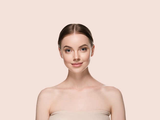 Skin care woman face with healthy beauty skin closeup cosmetic age concept. Color background yellow