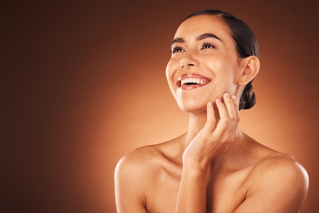 Skincare beauty and face of Latin woman with smile for wellness dermatology and luxury spa in studio Makeup cosmetics and girl with healthy natural and glowing skin on brown background for salon