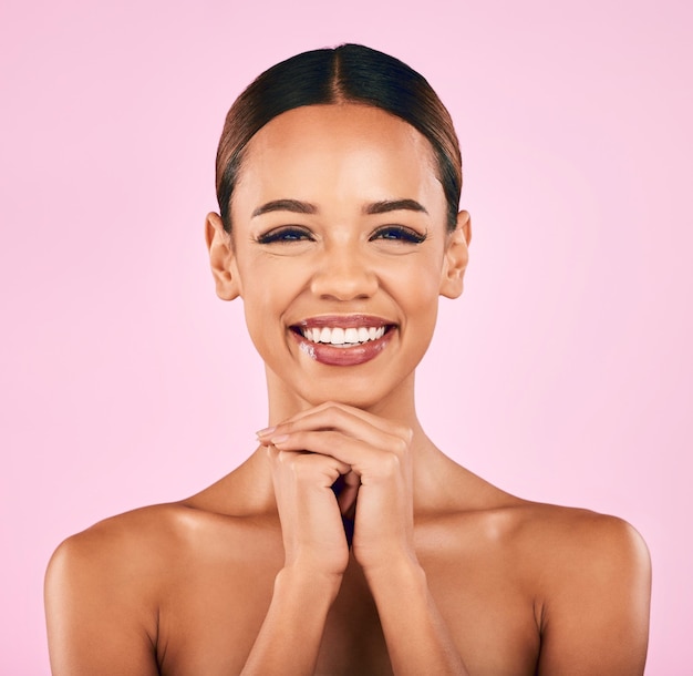 Skincare makeup and portrait of happy woman with natural beauty wellness and glow on pink background Cosmetics dermatology and model with smile luxury facial care and spa aesthetic in studio