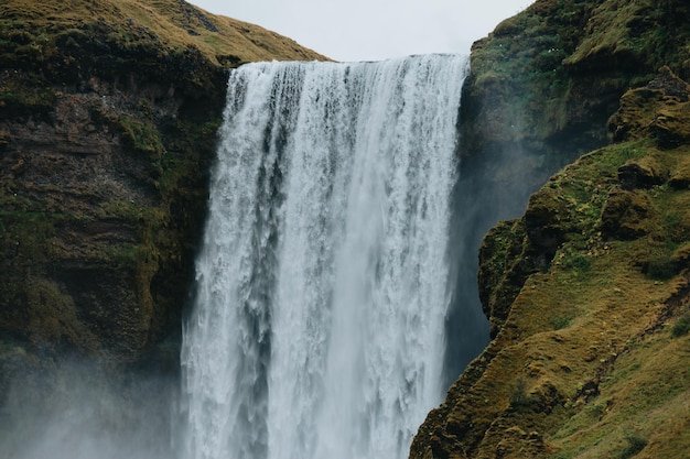 Skogafoss waterfall in Iceland during a moody day Travel on van concept road trip style Visit Iceland and north countries conceptCopy space image