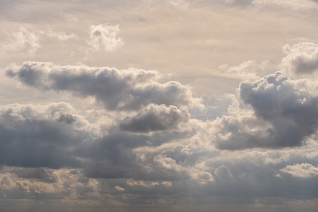 Sky full of clouds and sunbeams shining through