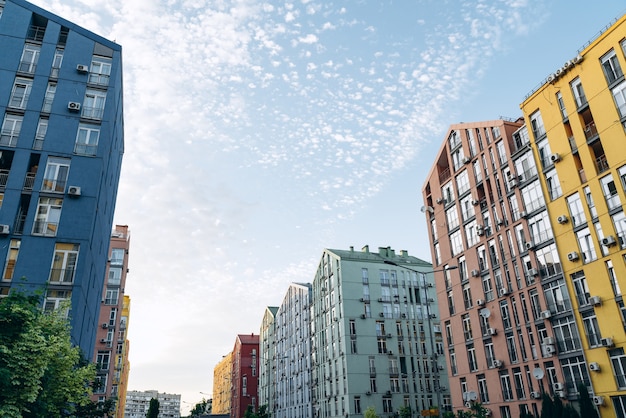 Sky in a modern, beautiful residential complex. Colored, beautiful houses in a bustling place.