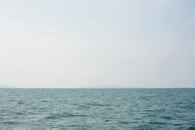 Sky and sea or ocean with an island is visible in distance