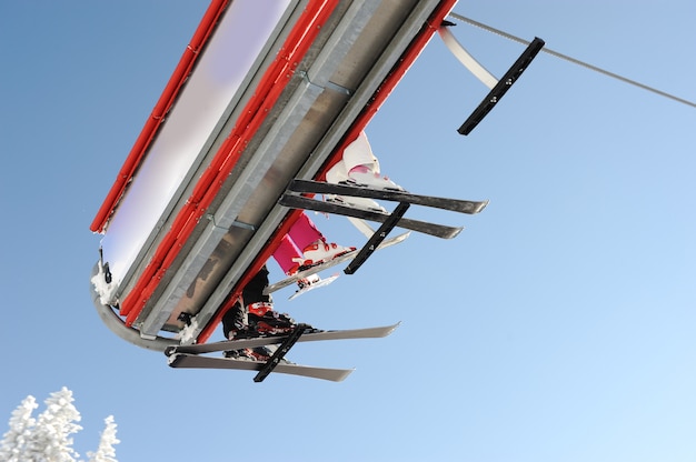 Sky sky lift carrying skiers.