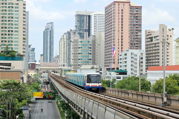 Sky train railway in Bangkok with business building