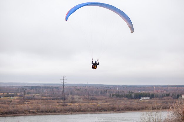 Skydiving extreme sports parachutist with a parachute unfolded